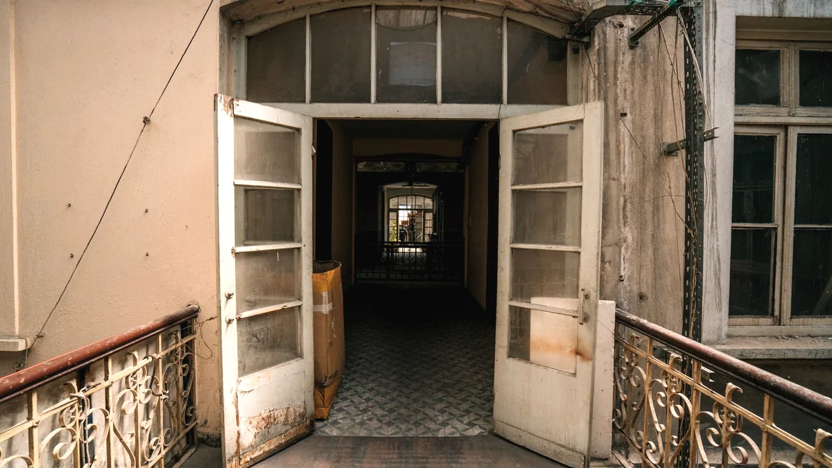 An open door with light coming through it.