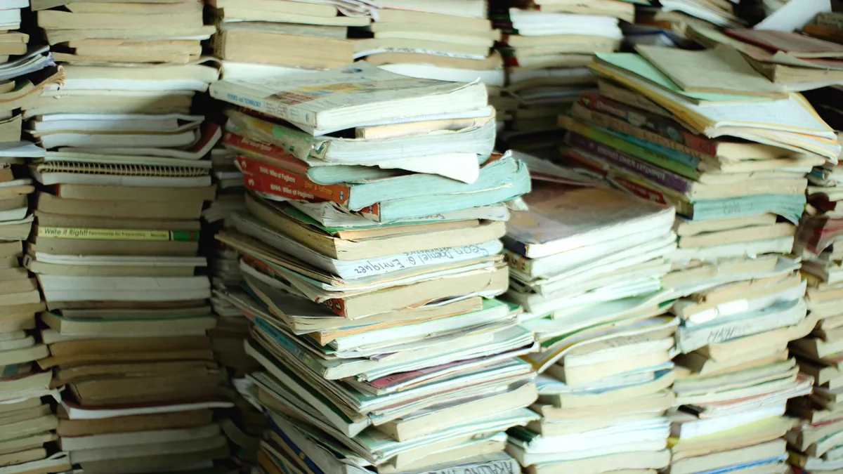 Used paperbacks stacked on their sides.