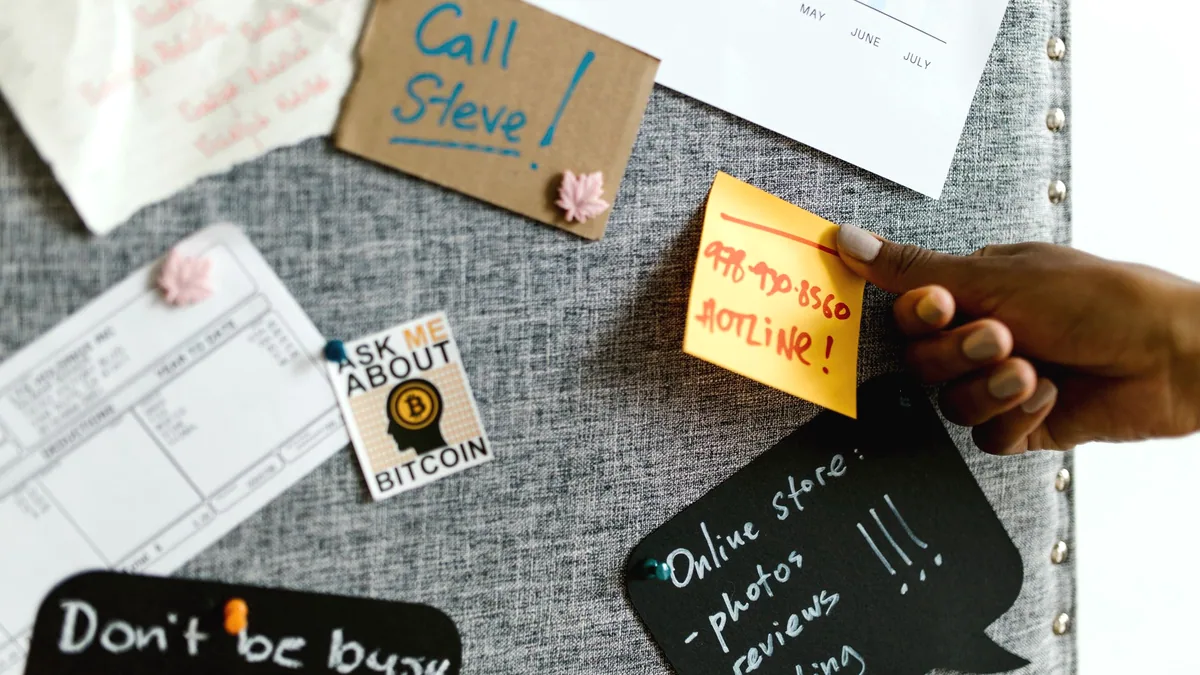 Index cards pinned up in rows.