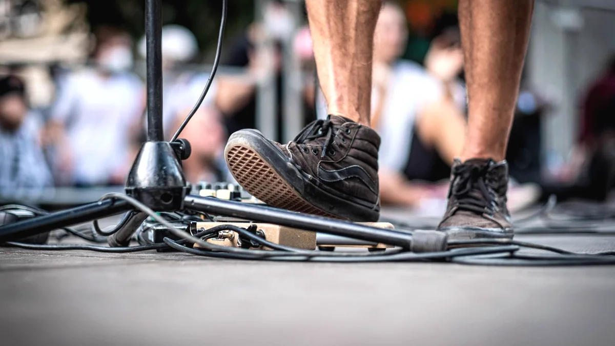 A microphone cable running away across a stage floor.